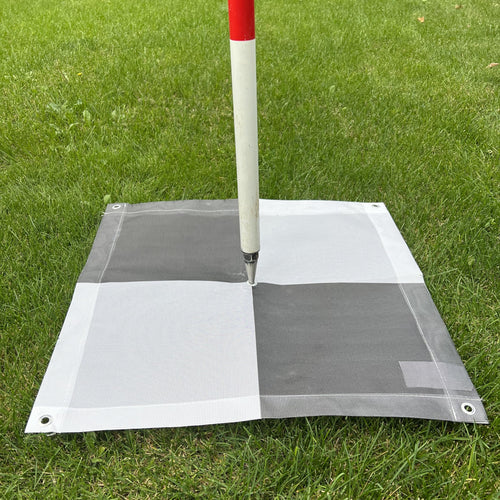 2x2 checkerboard GCP target staked in the field for drone surveying